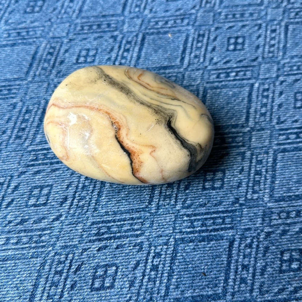 A bar of soap that looks like a river rock